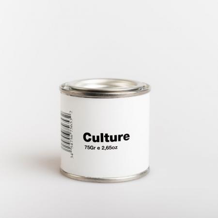 A white paint pot with the label that says Culture