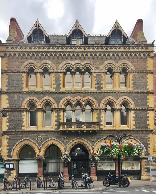 Image showing the outside of Hereford Museum Art Gallery and Library on Broad Street. The red brick design has many windows and is four storeys tall.