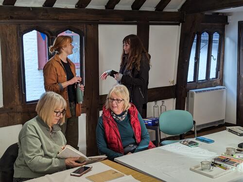 Create an exhibition volunteer group volunteers at Ledbury Places exhibit