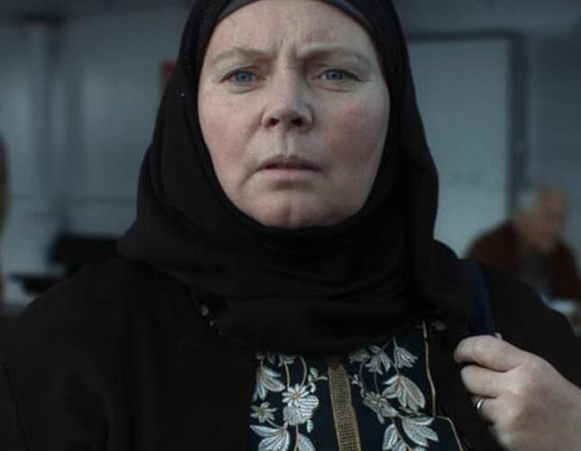 Image of white woman in black hijab, a scene from the film After Love.