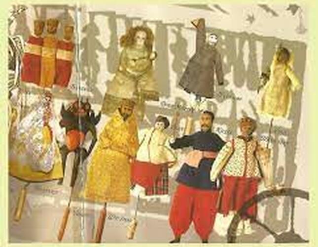 Image of wooden puppets in brightly coloured clothes